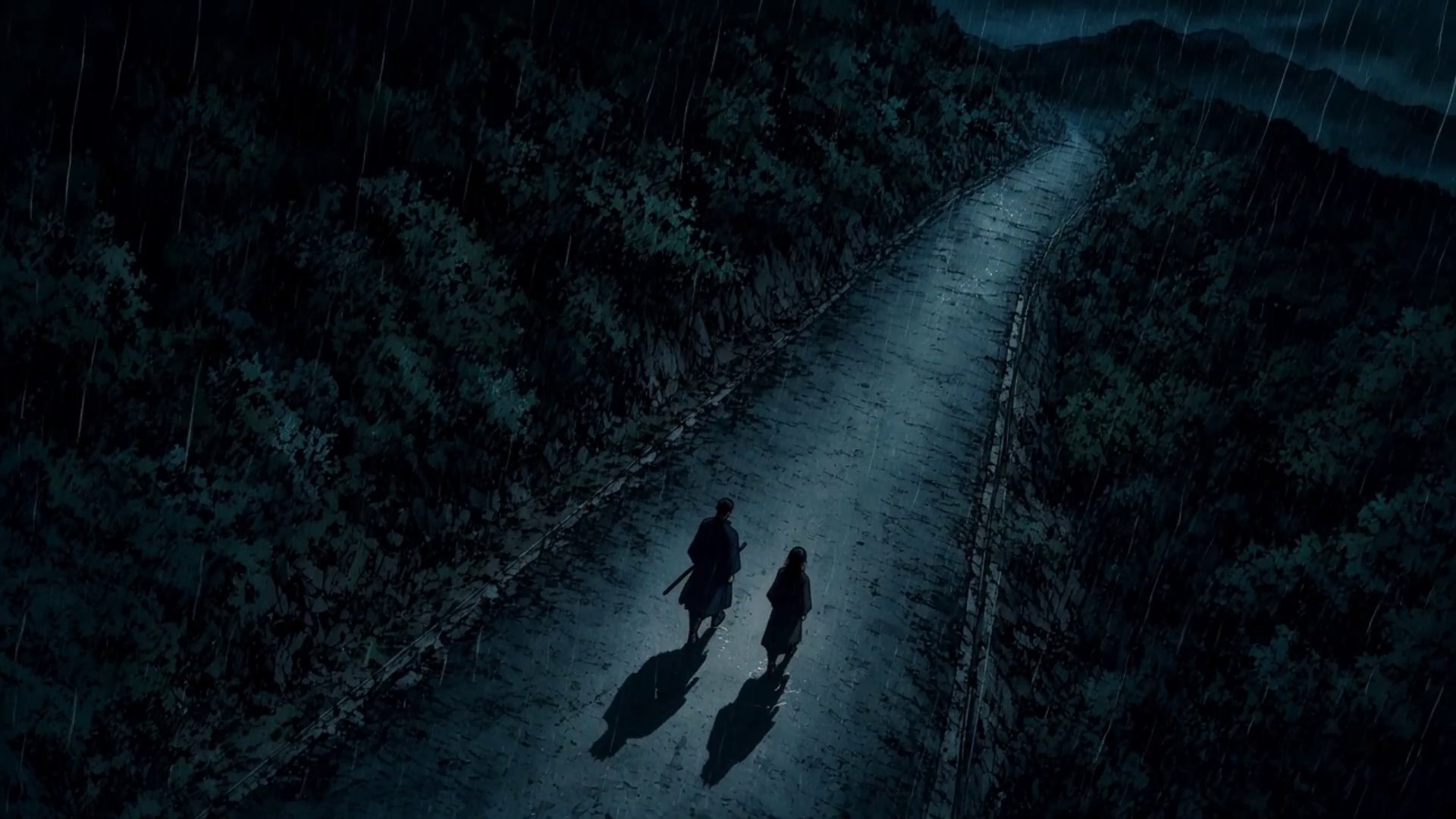 Iori and Shizuka from above, walking a mountain road in the rain, one step apart